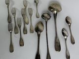 a lot of silver spoons and forks on the table