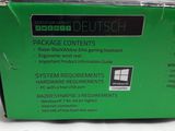an image of a green box containing a package of contents for a computer