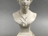 marble bust of a woman with a turban on her head