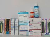 a lot of medicine products on a white table
