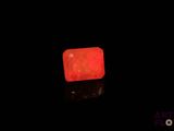 a red light that is glowing in the dark