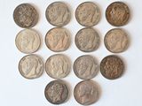 a lot of coins that are on a white surface