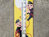a thermometer with a picture of a man and a dog on it