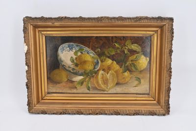 un tableau représentant des citrons et un bol de citrons posés sur une table