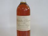 an image of a bottle of wine sitting on top of a table