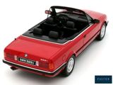 red bmw convertible car with open top on a white surface
