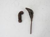 two old canes that are on a white surface