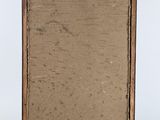 an old wooden easel with a piece of paper on top of it