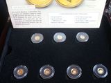 a box of gold coins with a picture of a man on it
