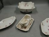 five plates and a bowl on the table