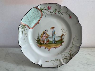 a plate with a picture of a man and a woman on it