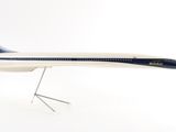 a model of an airplane on a stand on a white surface