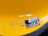 a sticker on the back of a yellow motorcycle