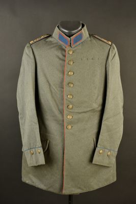 a green military coat with a red stripe on the collar