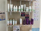 a shelf with many different types of skin care products on it