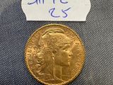 a close up of a gold coin with a label on it