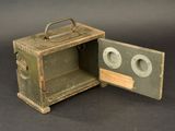 a small metal box with two eyes inside of it