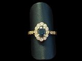 a close up of a ring on a black surface with a black background