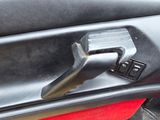 a close up of a door handle in a car