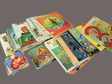 many children ' s books that are stacked on top of each other