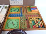 a wooden box filled with different types of game pieces
