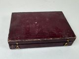 a small wooden box with a handle on a white surface