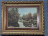 an image of a painting of a river in a gold frame on a blue wall