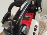 a chainsaw that is sitting on a plastic bag
