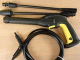 a yellow and black pressurer and a hose on a table