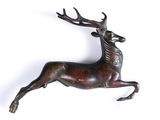 an image of a bronze statue of a deer on a white background