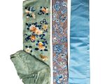 several different ties are laid out on a white surface