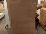 a large cardboard box sitting on top of a pallet in a warehouse