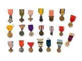 a lot of medals that are on a white surface