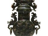 a large green vase that is on display on a white background