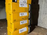 three boxes are stacked on top of each other on a shelf