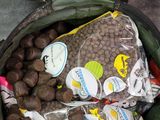 a bag of food in a green container on a table