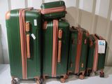 several pieces of luggage sitting on top of each other on a table