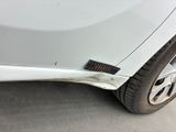 a close up of a car ' s bumper with a sticker on it