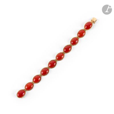 a yellow gold and red jade bracelet