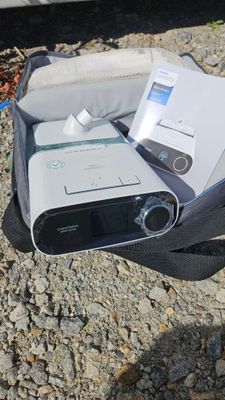 a bag with a remote and a mp3 player in it