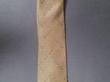 an image of a yellow necktie on a gray background