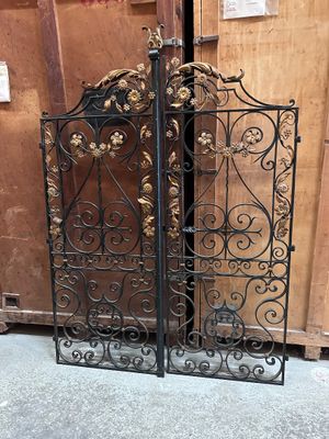 pair of antique wrought iron gates with flowers and scrolls