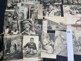 many old photos of people and animals on the table