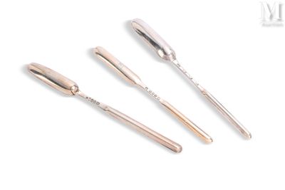 three silver spoons and a fork sitting next to each other