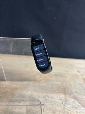 a smart watch sitting on top of a wooden table