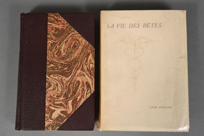 two books sitting next to each other on top of a table