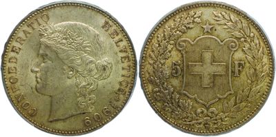 a gold coin with a cross on the front and a crown on the back