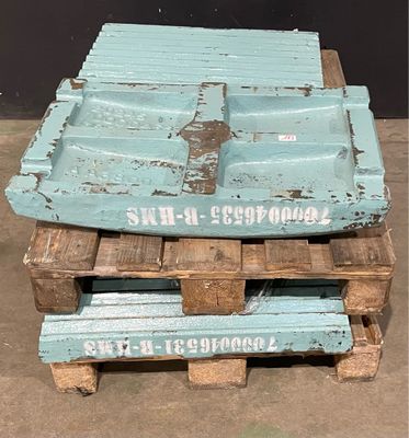 a stack of wooden pallets sitting on the ground