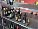 many bottles of wine on the shelves in the store