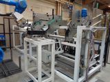 a machine that is working on a piece of paper